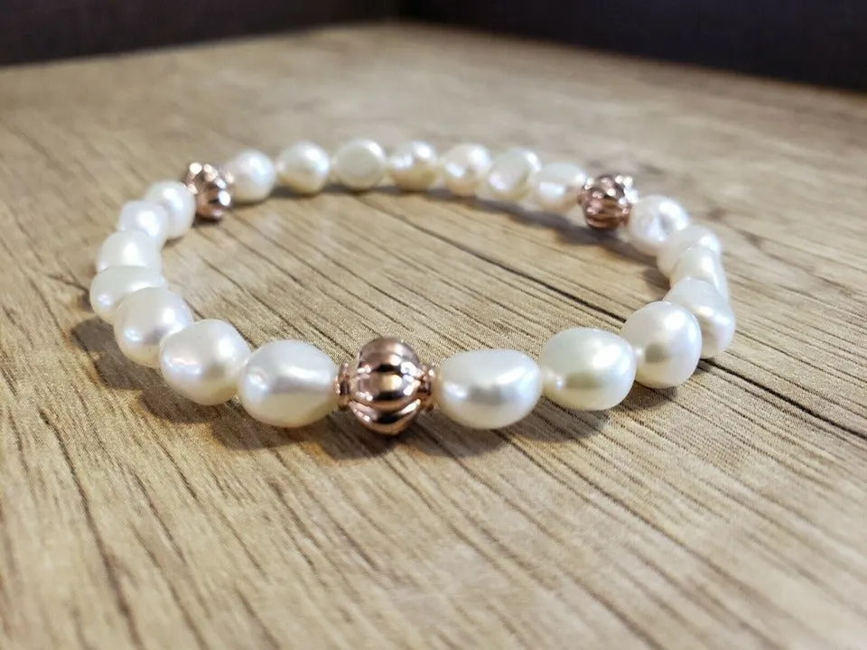 Hand Crafted, All Natural Freshwater Pink Pearl stretch Bracelet with Rose Gold Tone Metal. One size fits most